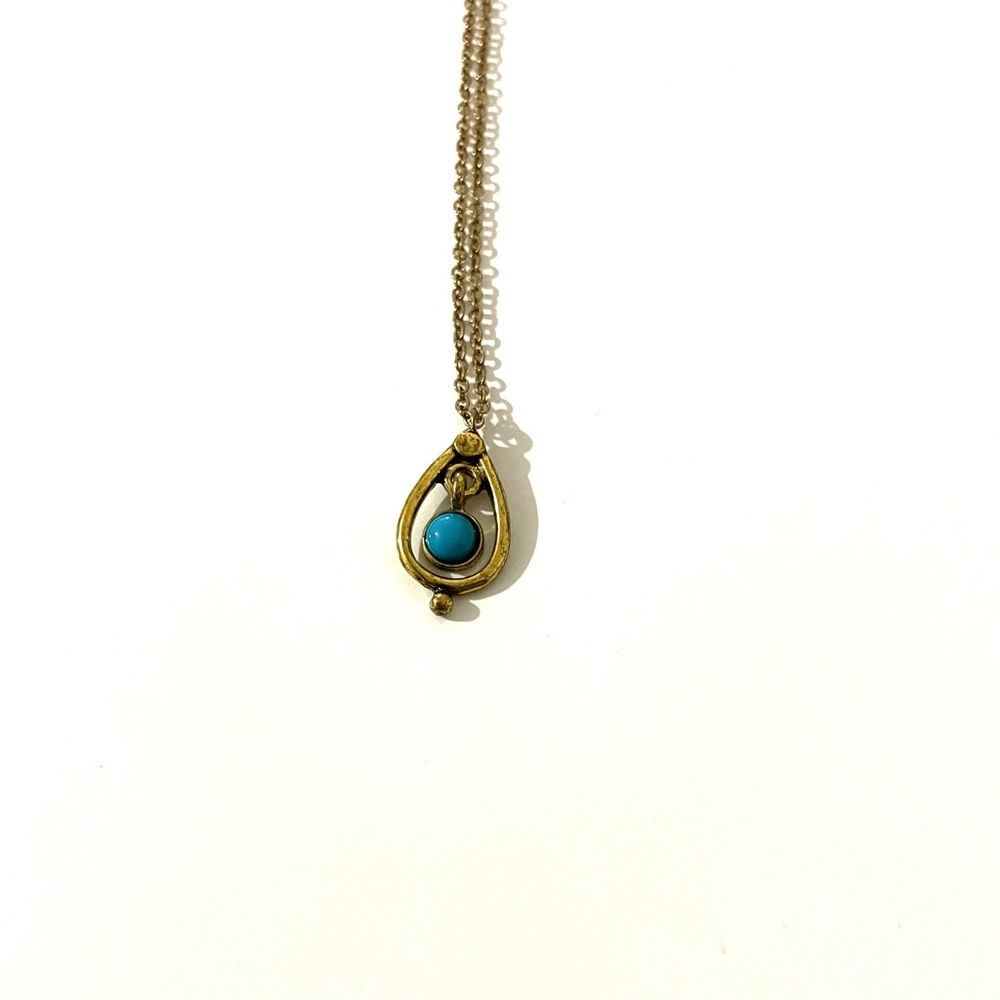 Cute gold and blue pendant on gold necklace